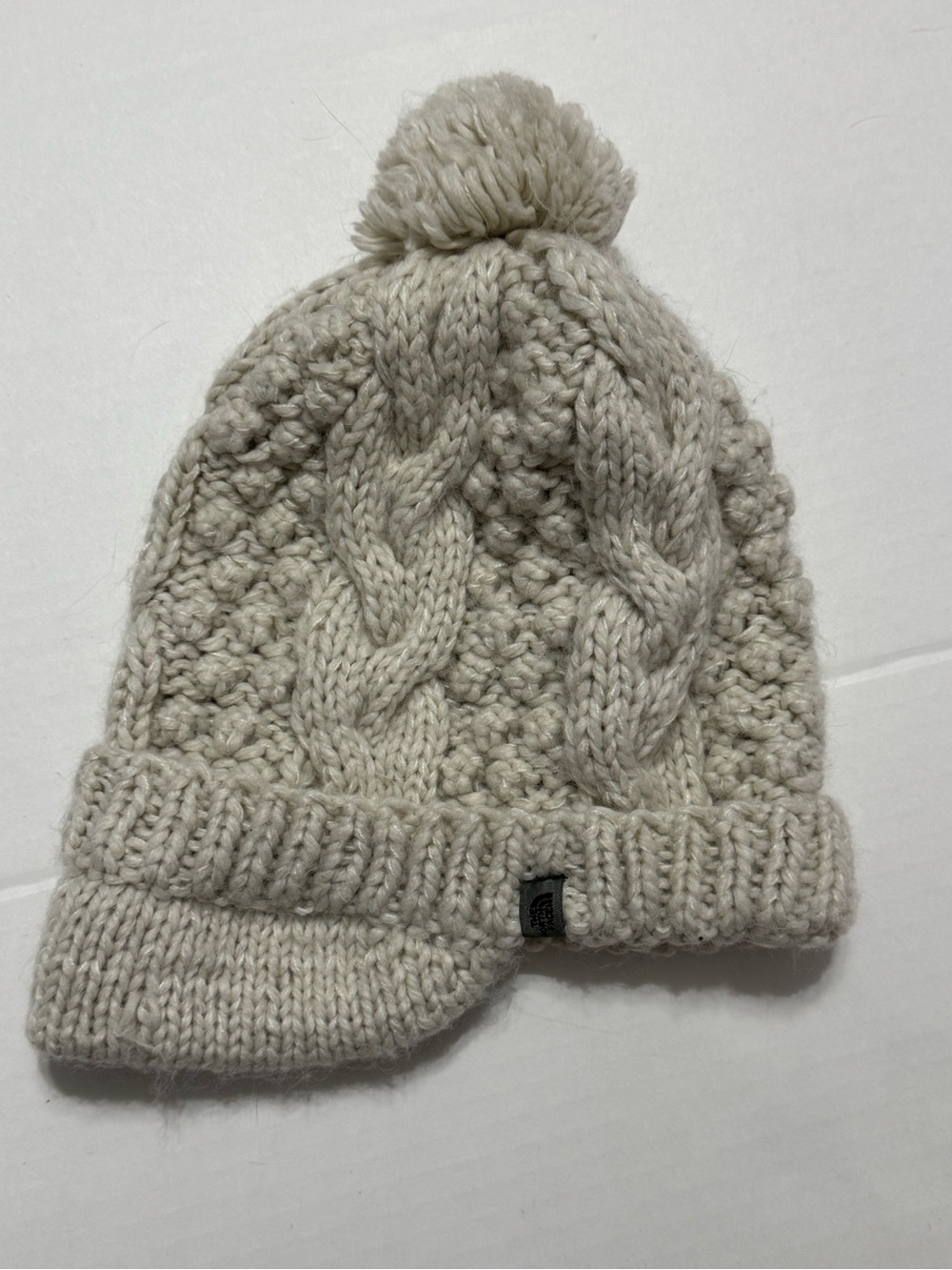 The North Face AVQP Cable
Knit Pom Pom Beanie
